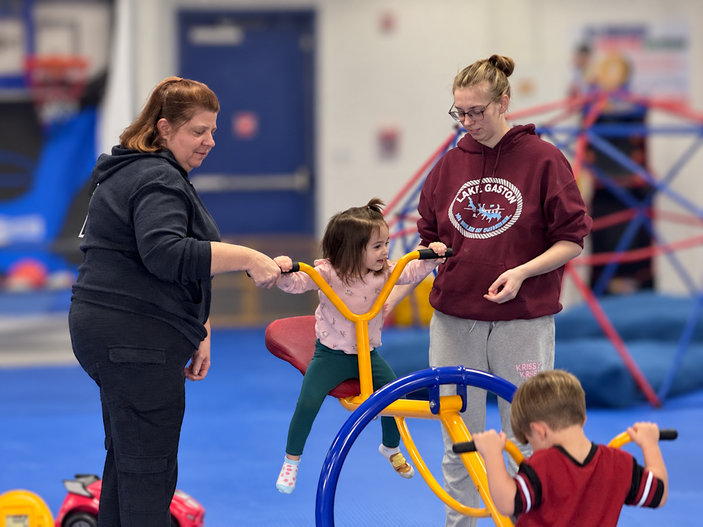 Adults Guiding Joyful Gym Play (1)
